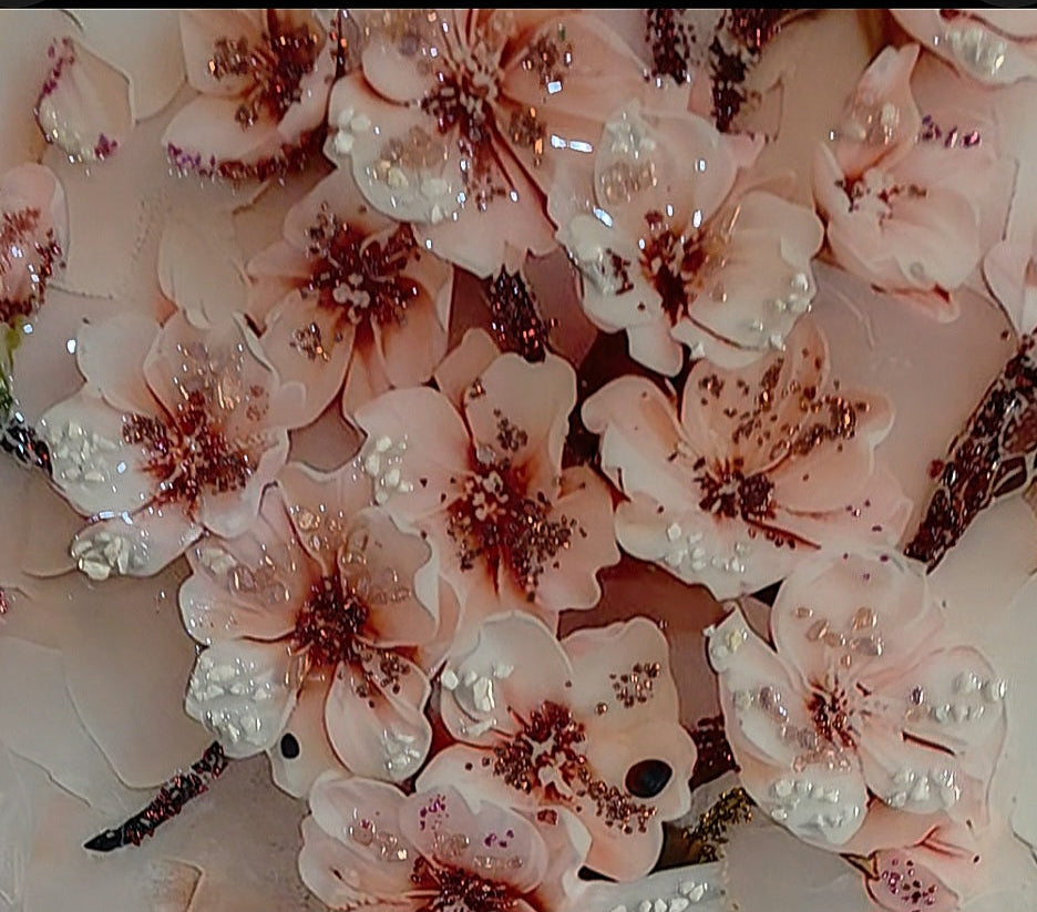 A closer focus on the blush peonies, highlighting their layered texture, soft colour variations and shimmering hand-applied details.