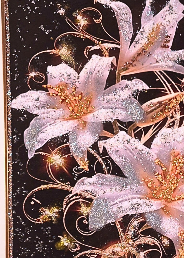 Lilies After Dark – framed 50 × 70 cm floral wall art with three ivory lilies on a black background, enhanced with gold, silver and sparkling embellishments.