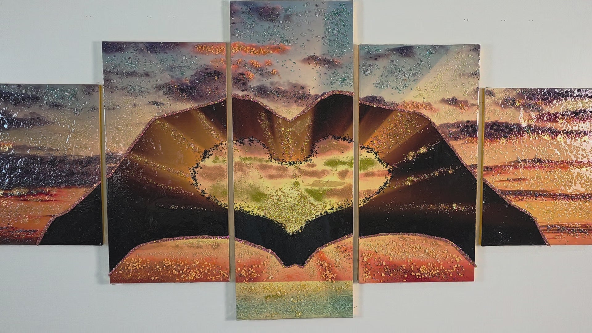 Video showing the complete Sunset in Our Hands five-panel wall art in balanced neutral lighting, displaying the full artwork and handcrafted details across all five panels.