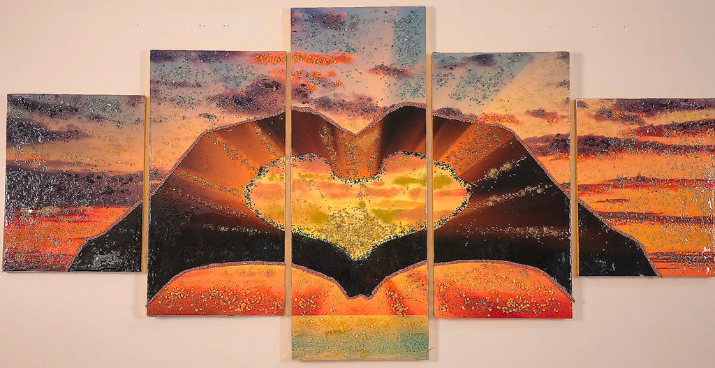 Sunset in Our Hands five-panel wall art shown in balanced neutral lighting, featuring two hands cradling a glowing sunset landscape.