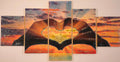 Sunset in Our Hands five-panel wall art shown in balanced neutral lighting, featuring two hands cradling a glowing sunset landscape.